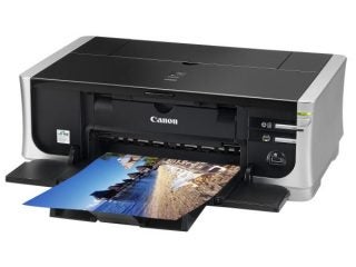Canon PIXMA iP4500 printer with a color printed photo.