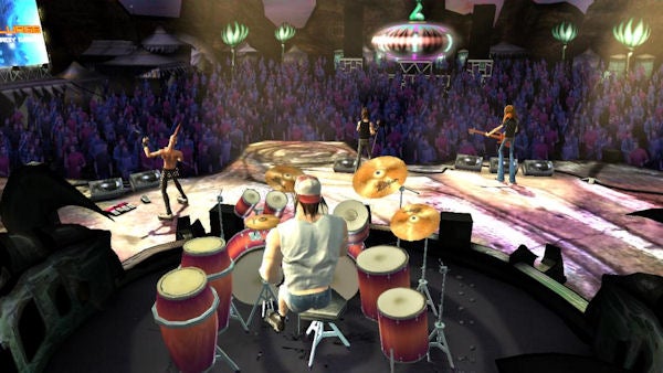 Screenshot from Guitar Hero III showing band on stage.Screenshot of Guitar Hero III gameplay showing a band on stage.