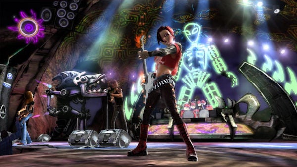 Screenshot of Guitar Hero III gameplay with animated band on stage.Animated band performing on stage in Guitar Hero III game.