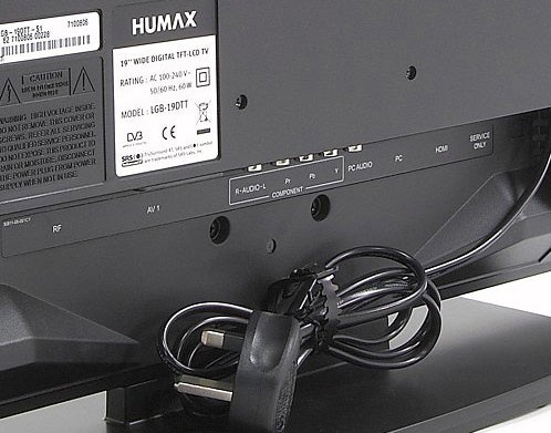 Humax LGB-19DTT 19-inch LCD TV back panel with label and cables.Back view of Humax LGB-19DTT LCD TV showing ports and label.