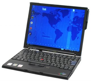 Lenovo ThinkPad X61s laptop with screen displaying world map wallpaper.