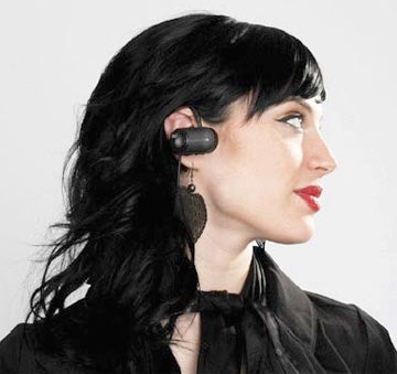 Woman wearing iSkin Cerulean F1 Bluetooth Earphone.