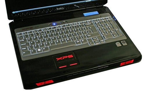 Dell XPS M1730 laptop with illuminated keyboard and logoDell XPS M1730 laptop with keyboard and red accent lighting.