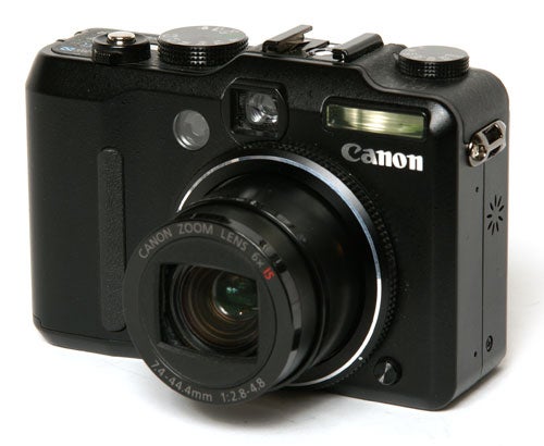 Canon PowerShot G9 camera on white background.