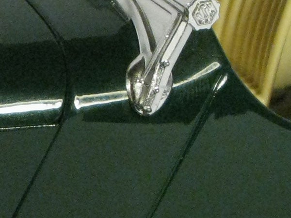 Close-up of a camera's metallic details and texturesClose-up of Canon PowerShot G9 camera's strap lug.