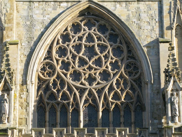 Detailed photo of cathedral's rose window architecture.Detailed photo of church's gothic window architecture.