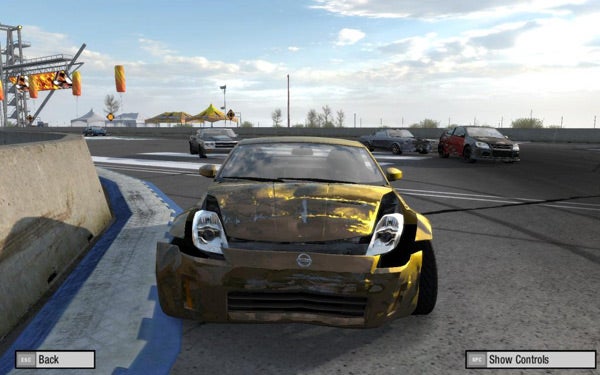 Need for Speed: Pro Street gameplay showing damaged car on track.Screenshot of a damaged car in Need for Speed: Pro Street.