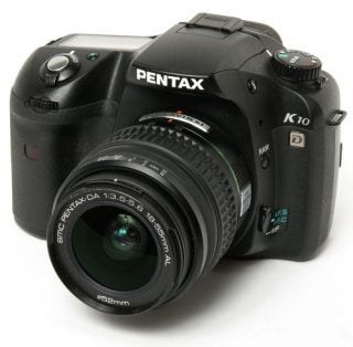 Pentax K10D Digital SLR camera on white background.