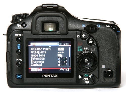 Pentax K10D DSLR displaying settings on its LCD screen.Pentax K10D DSLR camera with settings menu displayed.