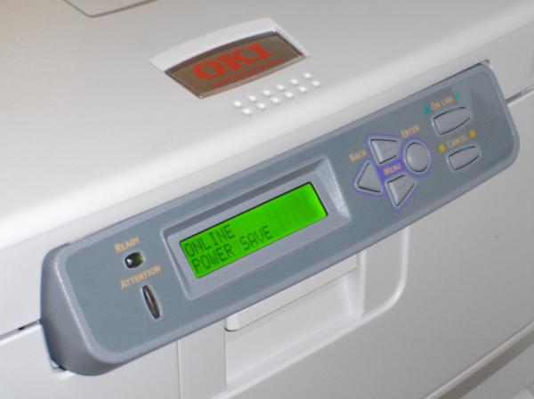 Close-up of OKI C8800n printer control panel with display screen.