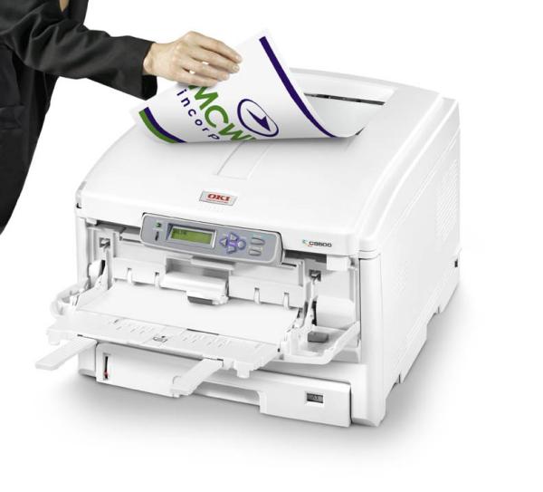 Person loading paper into OKI C8800n A3 printerPerson inserting paper into OKI C8800n A3 Printer.