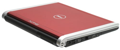 Dell XPS M1530 laptop with red lid closedDell XPS M1530 laptop with red lid and side ports visible.
