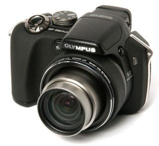 Olympus SP-560UZ digital camera on white background.