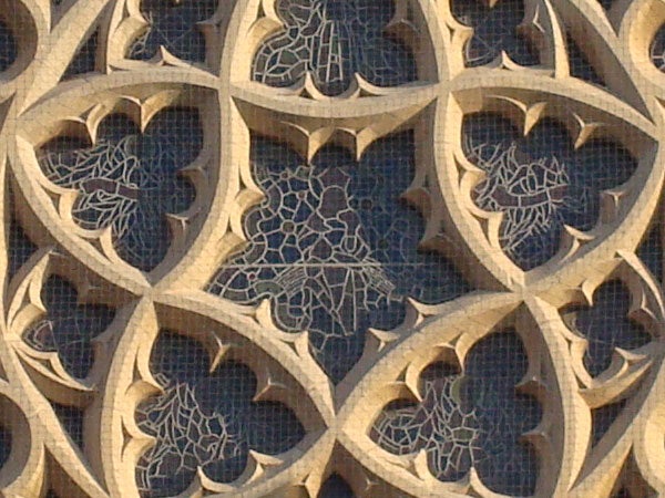 Intricate stone lattice work with floral design.