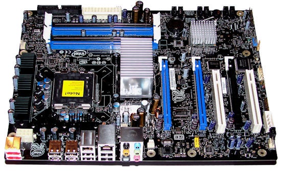 Intel DX38BT X38 motherboard with heatsinks and slotsIntel DX38BT X38 ATX motherboard with various ports and slots.