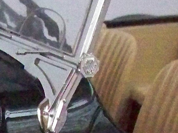 photo of an indoor scene with metallic objects.photo of a glasses close-up and background objects.