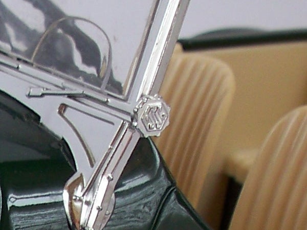 Close-up of a camera's details highlighting build quality.Close-up of camera exterior showing part of Kodak logo.