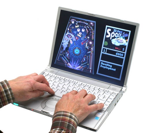 Person using Panasonic ToughBook CF-Y7 to play a pinball game.Person playing pinball game on Panasonic ToughBook CF-Y7 laptop.