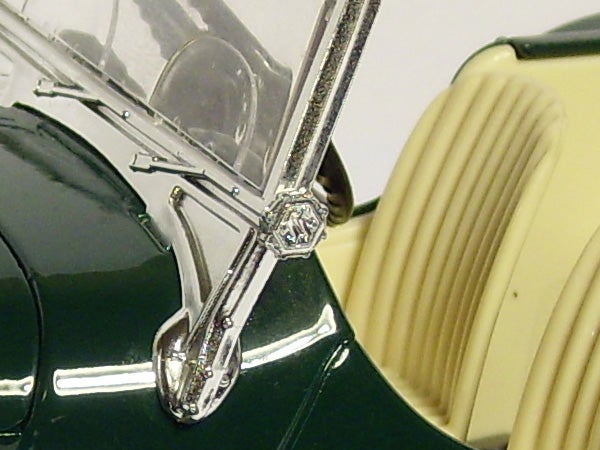 Close-up of vintage car model's windshield wiper detail