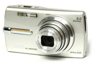 Olympus mju 830 digital camera on white background.