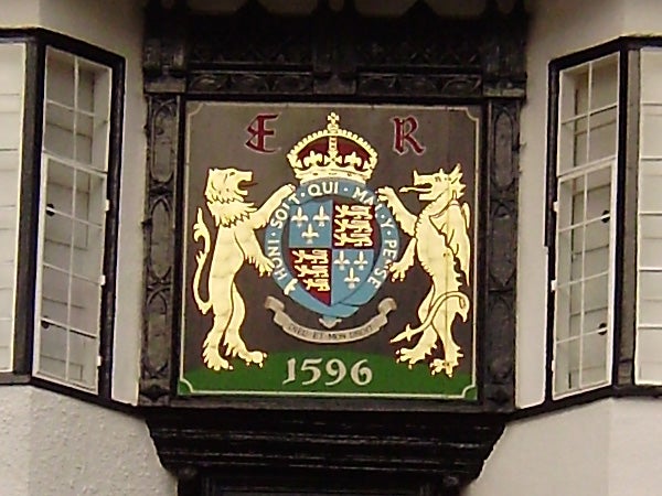 Ornate crest on a building facade dated 1596.Ornate coat of arms on a building from 1596.