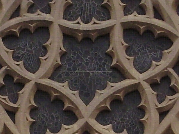 Intricate stone lattice work in gothic architectural style.Intricate stone lattice work with quatrefoil patterns.