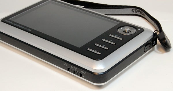 Cowon A3 portable multimedia player on white surface.Cowon A3 30GB portable multimedia player on a table