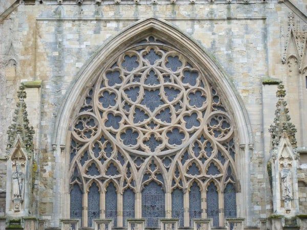 Detailed photo of a Gothic church window design.Intricate gothic window architecture captured in high detail.