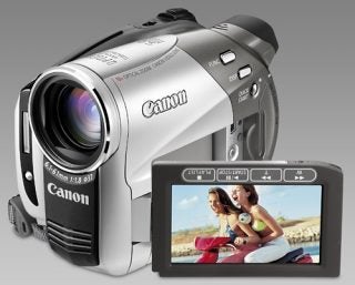 Canon DC50 camcorder with flip-out screen displaying two women.