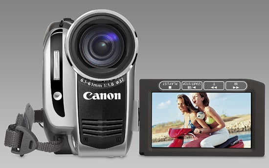 Canon DC50 camcorder with flip-out LCD screen displaying photo.Canon DC50 camcorder with flip-out LCD display showing content.