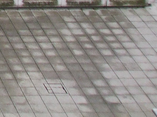 image of a tiled floor demonstrating camera's poor focus.Blurred image of a tiled floor captured by a camera.