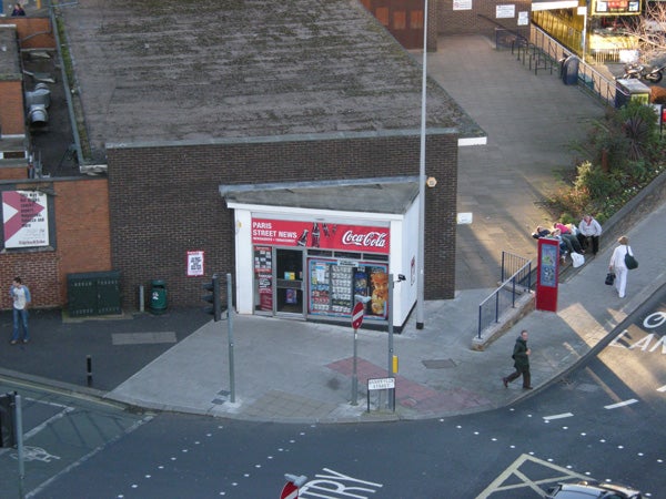 Aerial view of a street corner and newsstand