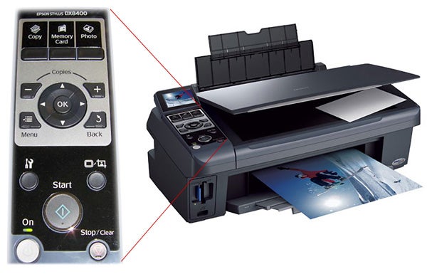 Epson Stylus DX8400 printer with control panel and photo printout.