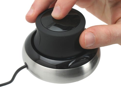 Hand operating a 3Dconnexion SpaceNavigator 3D Mouse.