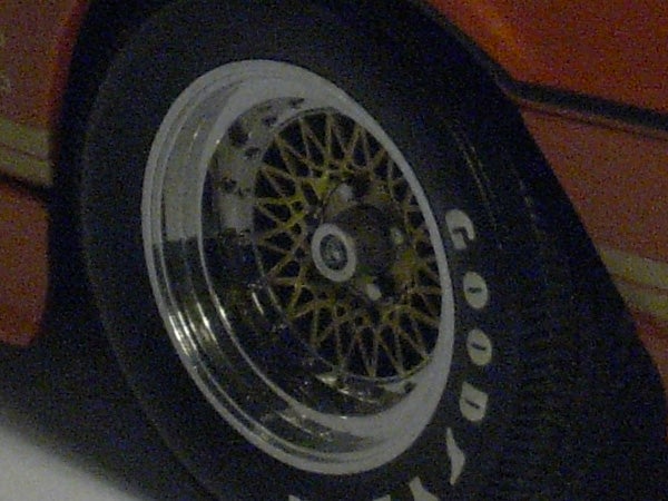 Close-up of a model car wheel and tire.