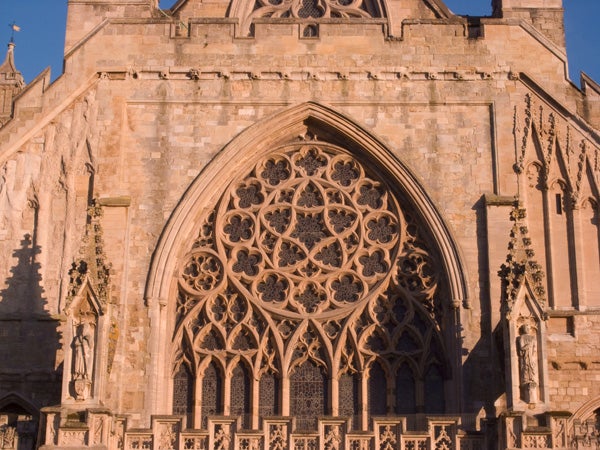 Photo of a cathedral's intricate Gothic window.
