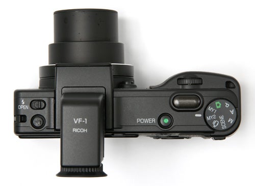 Ricoh Caplio GX100 camera with VF-1 viewfinder attached.