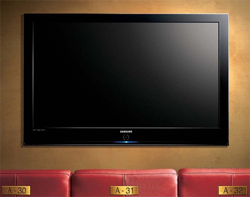 Samsung PS50Q97HDX 50-inch plasma TV mounted on wall.