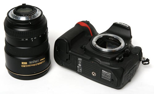 Nikon D300 camera body alongside a Nikkor lens.