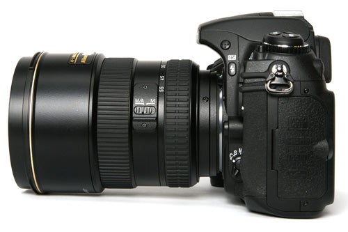 Nikon D300 DSLR camera with telephoto lens attached.