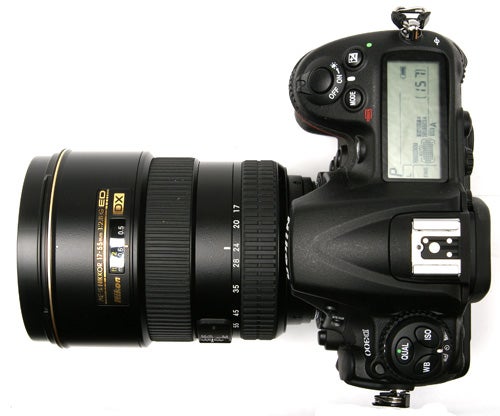 Nikon D300 DSLR camera with lens on white background.