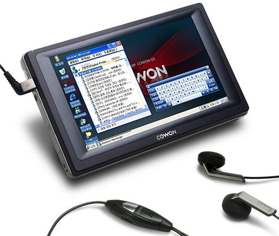 Cowon Q5W portable media player with earbuds and touchscreen display.
