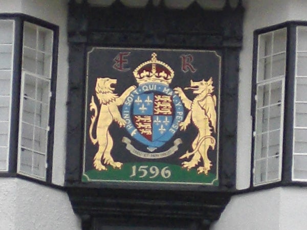 Coat of arms on a building captured in low resolution.