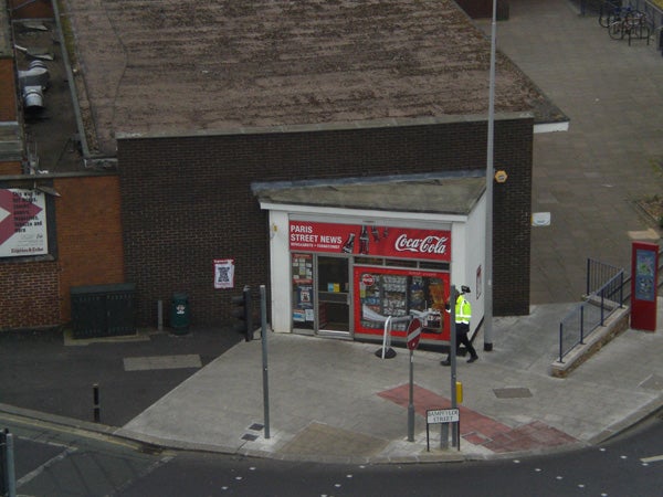 Aerial view of a street corner convenience store.