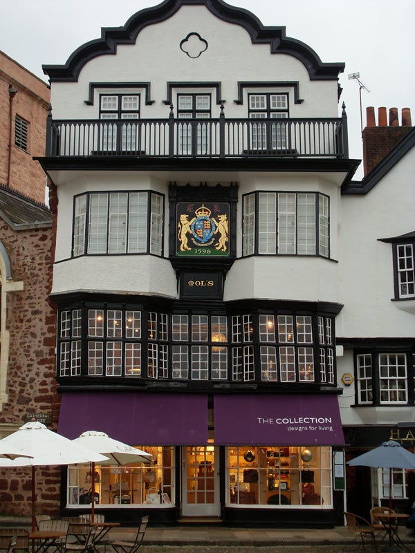 Traditional black and white Tudor-style building with a shop.Traditional Tudor style building with a shop front.