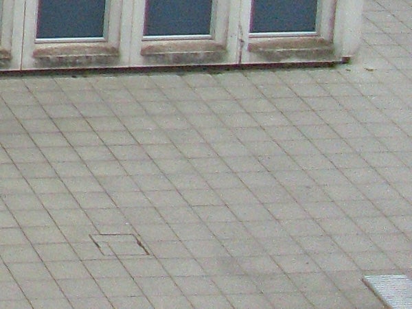 image of a building facade and tiled floor.photo of a building facade and tiled floor.