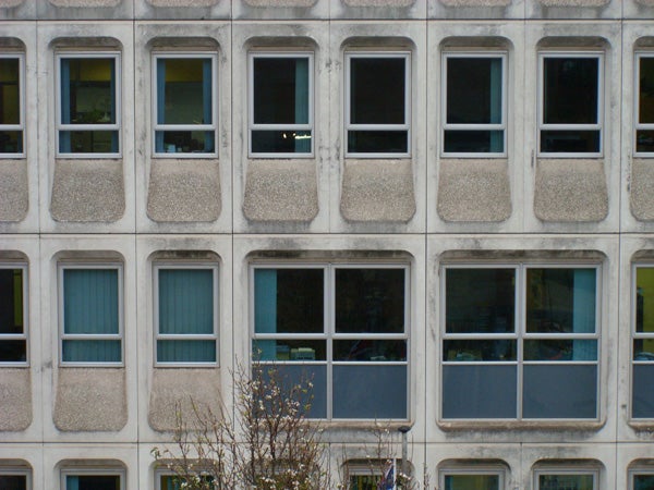 Facade of a building with patterned windows.Facade of building with repetitive windows pattern