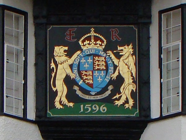 Coat of arms on a building facade from 1596.Coat of arms plaque with lions and a crown from 1596.