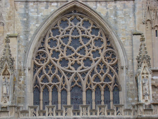 Intricate stone church window with gothic architecture details.Intricate gothic church window architecture.