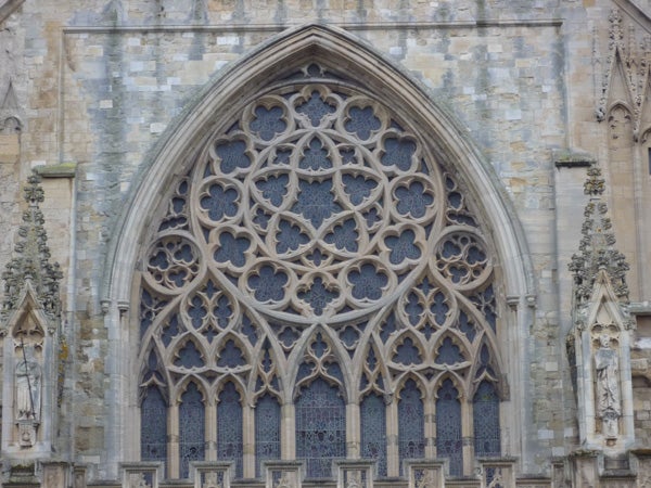 Detailed photo of a gothic church window patternDetailed photo of gothic cathedral window architecture